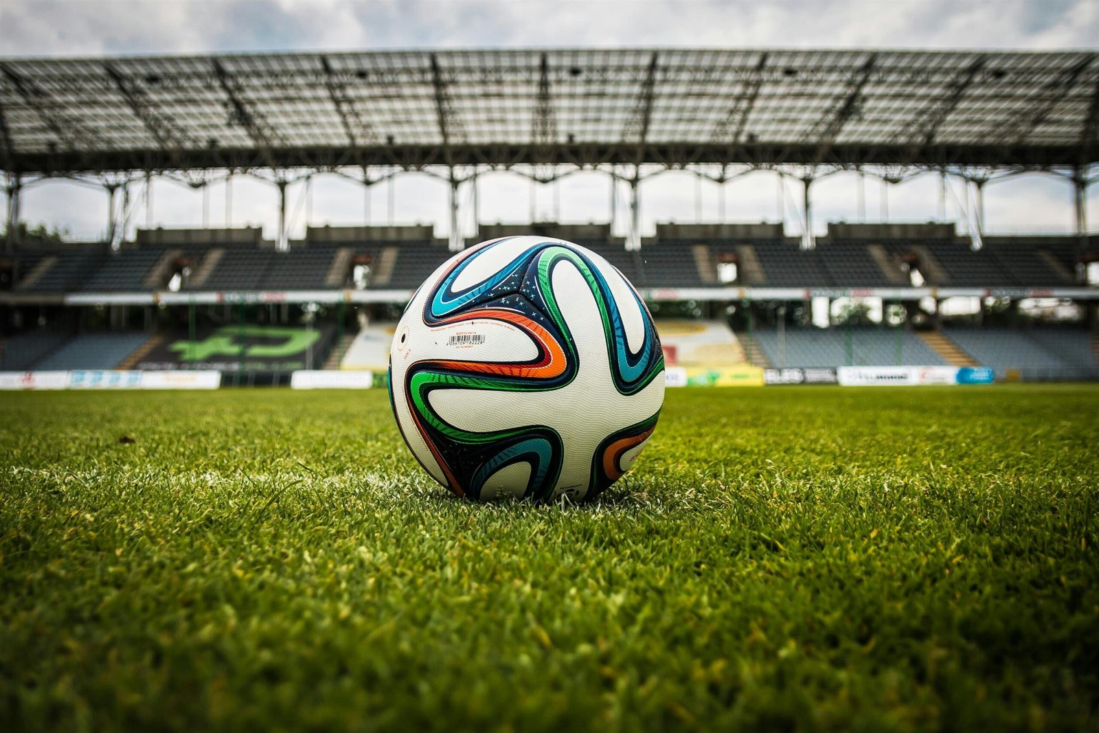 Football on the pitch before a match – start your football quiz on Certified Casual.
